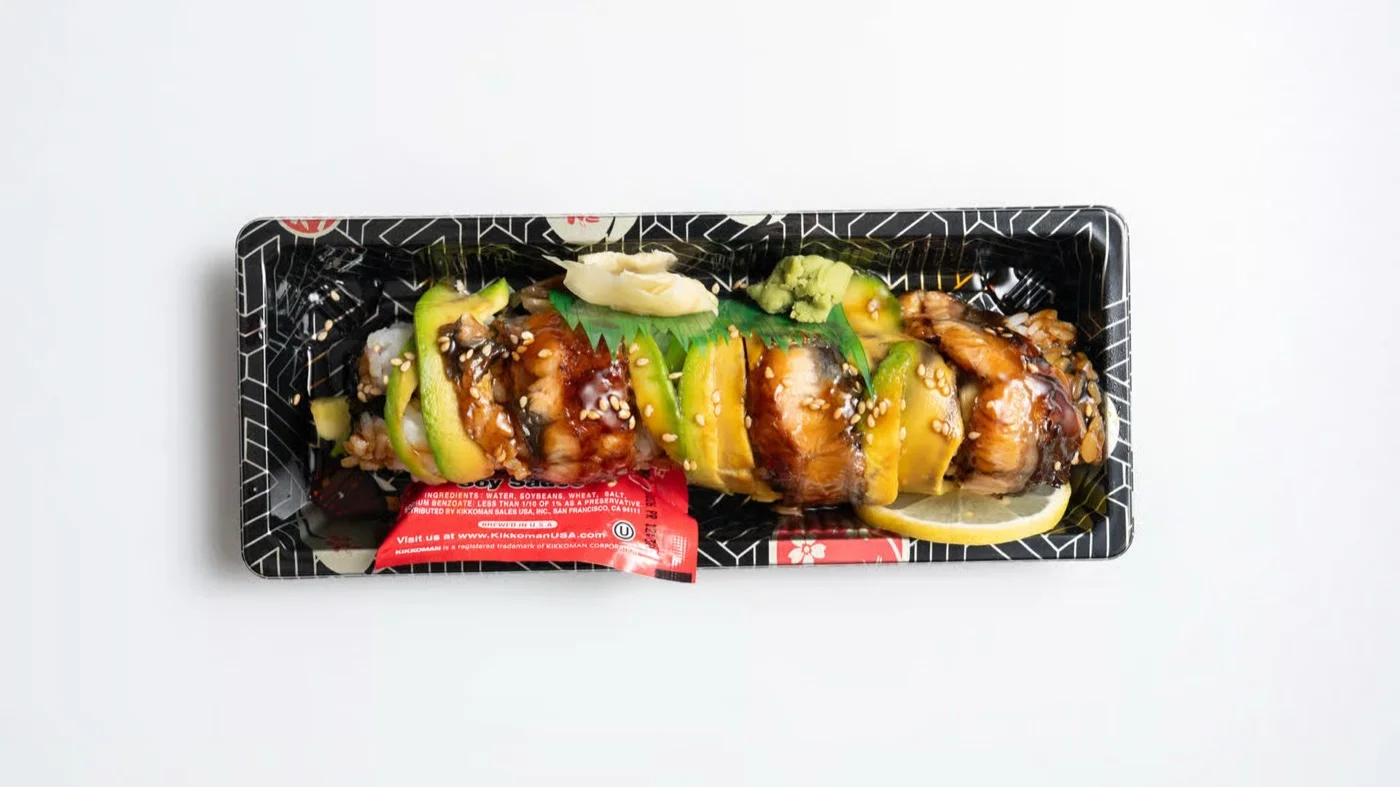 Dragon Roll — eel and avocado with teriyaki glaze and sesame